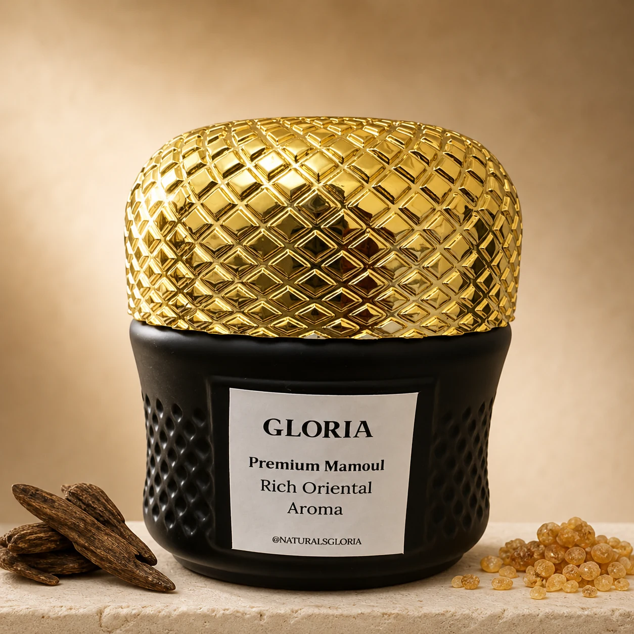 A Gloria bakhoor jar, black with a gold quilted lid, on a pale ledge