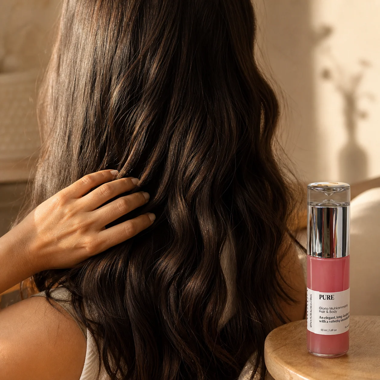 Oil being drawn through long dark hair
